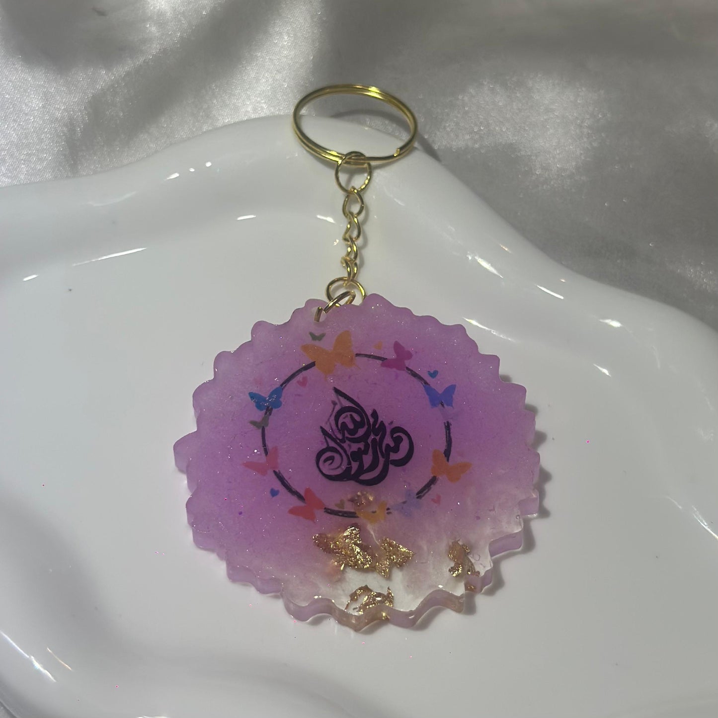 Quraan pink with butterflies cracked keychain